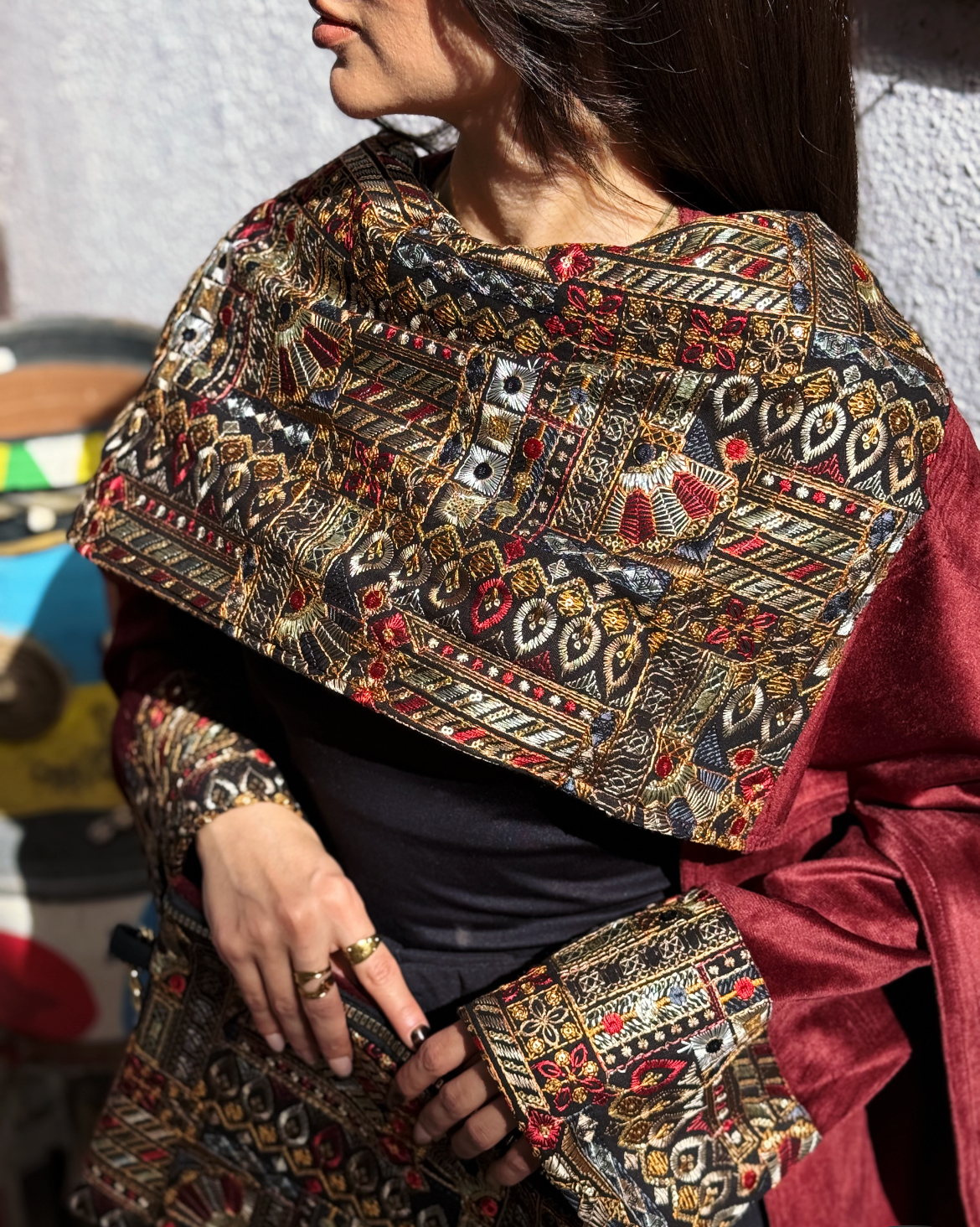 Burgundy Elegance Embroidered Velvet Kaftan showcasing its intricate geometric embroidery and luxurious velvet fabric.