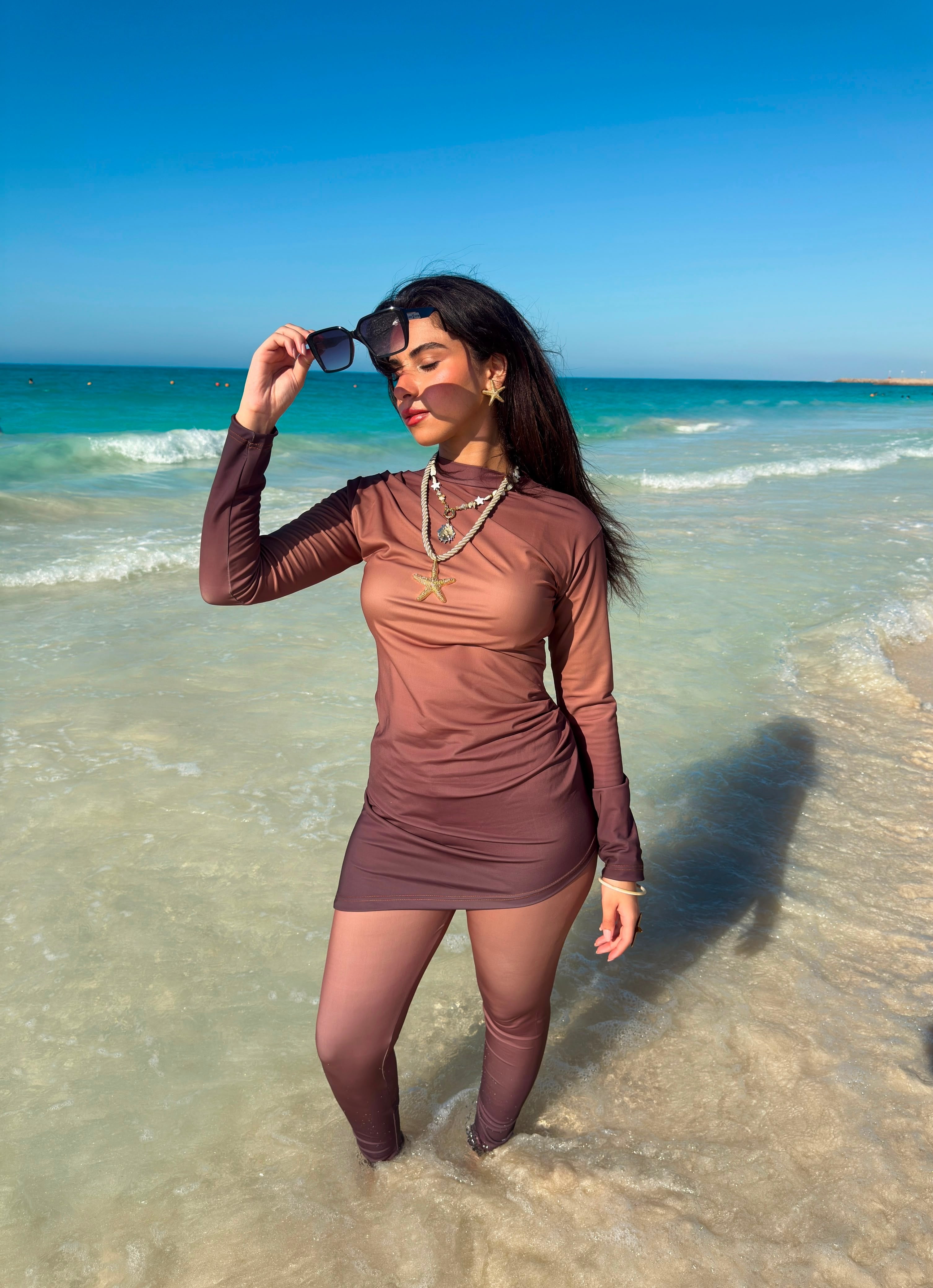 Ta’mayaa modest swimwear modest long sleeve swim dress with leggings on beach