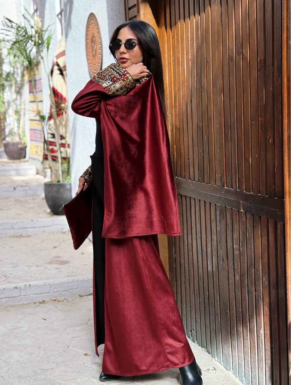 Burgundy Elegance Embroidered Velvet Kaftan styled with sunglasses and a clutch, showcasing its rich texture and elegant design.
